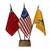 A display of historical stick flags featuring the Betsy Ross flag, the Gadsden flag, and the British Red Ensign flag.