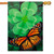 A house flag depicting a large green four-leaf clover and a monarch butterfly.