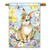 A house flag picturing a rabbit wearing a flower surrounded by Easter eggs and flowers.