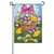 A garden flag featuring a basket filled with Easter eggs, surrounded by flowers, butterflies, and three fluffy chicks.