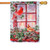 A house flag depicting two cardinals perched on holly outside a window lit by candles. A house flag depicting two cardinals perched on holly outside a window lit by candles.