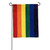 A rainbow flag hanging from a horizontal pole with vertical stripes of each color in the rainbow.