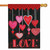 A flag with a red pattern at the top with pink and red hearts hanging from the pattern. There are eight hearts of different size and color suspended on white threads. The word "Love" is at the bottom in red stylized font.