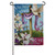 The Believe Suede Garden Flag depicts a dove in front of a crucifixion cross next to some flowers. The text "He has risen - Believe" is written on the flag.