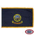 The indoor Idaho flag has 3 borders of gold fringe around the dark blue field. In the center is the seal of Idaho depicting Lady Justice & a miner. FMAA Certified Made in America seal. The indoor Idaho flag has 3 borders of gold fringe around the dark blue field. In the center is the seal of Idaho depicting Lady Justice & a miner. FMAA Certified Made in America seal.