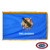 The indoor Oklahoma flag has 3 edges of gold fringe around the blue field. In the center is a shield with feathers, a calumet, & an olive branch. FMAA Certified Made in America seal.