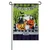 A green Halloween garden flag depicting the back of a truck filled with pumpkins, a cat, and a ghost. A banner at the top reads "Trick or Treat."