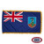 The indoor Montserrat flag has 3 sides of gold fringe around a blue field with a Union Jack in the canton and a coat of arms on the right. FMAA Certified Made in America seal.