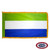 The indoor Sierra Leone flag has 3 sides of gold fringe around a horizontal green, white, and blue tricolor. FMAA Certified Made in America seal.