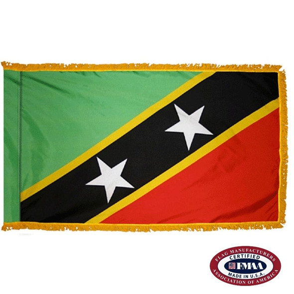 The indoor St. Kitts-Nevis flag has 3 sides of gold fringe around 2 green and red triangles separated by a black stripe with 2 white stars. FMAA Certified Made in America seal.