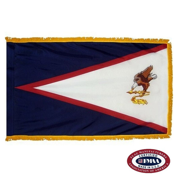 The indoor American Samoa flag has 3 sides of gold fringe around a blue field with a white triangle depicting a bald eagle and a club. FMAA Certified Made in America seal.