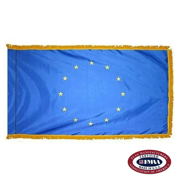 The indoor EU flag has 3 sides of gold fringe around a dark blue field with a circle of 12 gold stars in the center. FMAA Certified Made in America seal.