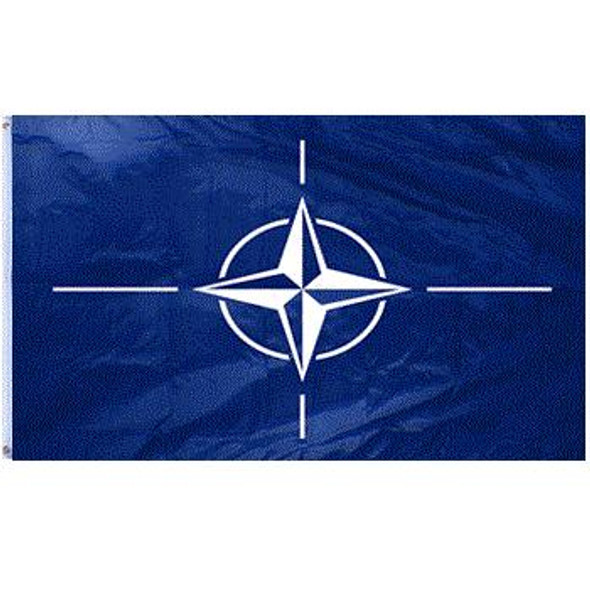 The NATO flag is dark blue with a white compass rose in the center surrounded by 4 white perpendicular lines.