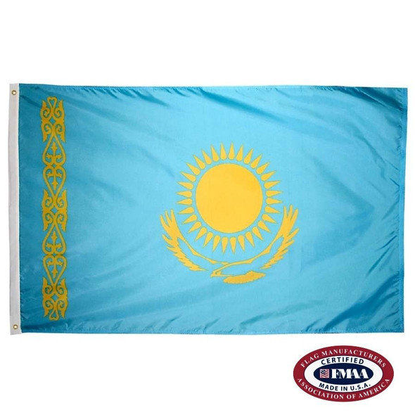 The Kazakhstan flag is light blue with a gold sun and an eagle in the center. On the left is a vertical gold ornamental pattern. FMAA Certified Made in America seal.
