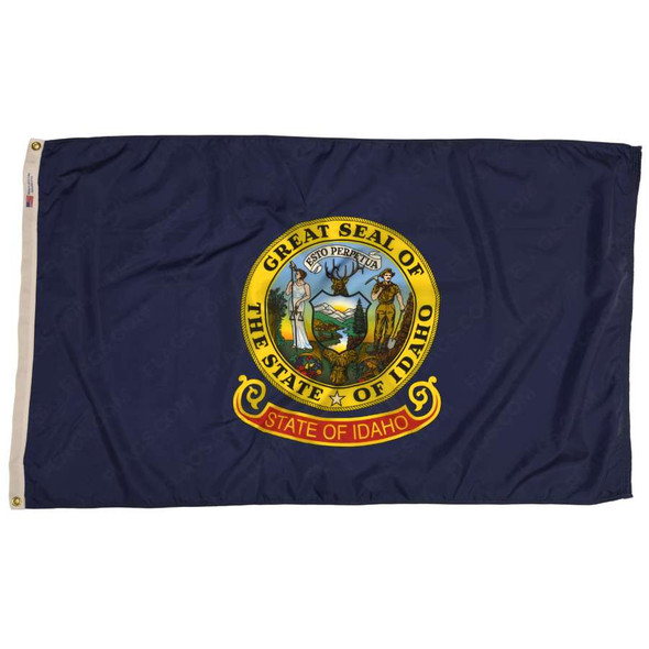 The Idaho flag is dark blue with the state seal in the center. In the seal stands Lady Justice & a miner on either side of the Idaho landscape.
