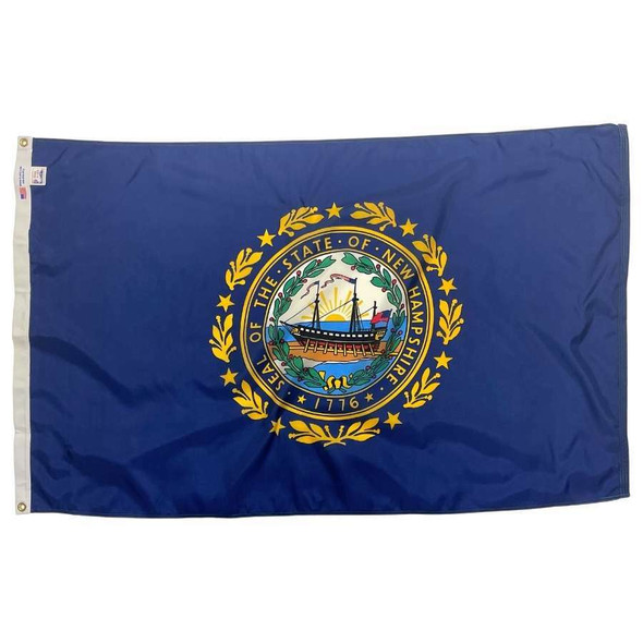 The dark blue New Hampshire flag has the state seal in the center. The seal depicts a ship at sea in front of a sunrise.