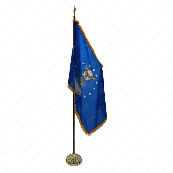 A US Air Force flag with gold fringe is displayed on an oak flagpole with a gold cord and tassel.