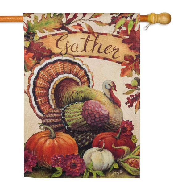 A Thanksgiving flag featuring a turkey, pumpkins, fall leaves, and a banner across the top that reads "Gather."