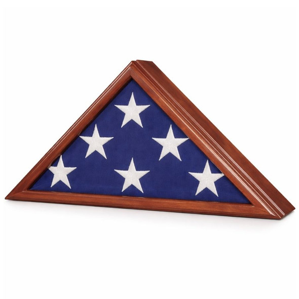 Triangular flag case made out of dark-colored wood.