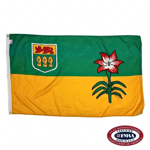 The Saskatchewan flag has 2 green & yellow stripes with a prairie lily on the right. In the top left is a yellow & green shield with a red lion. FMAA Certified Made in America seal.