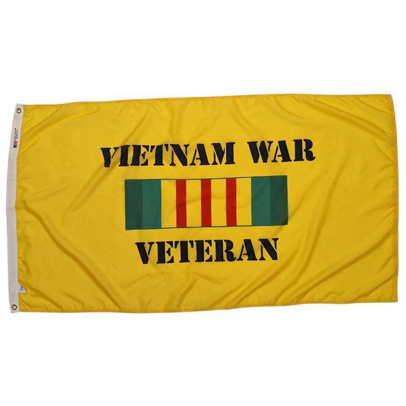 A Vietnam War Veteran flag. The field of the flag is yellow with a rectangle containing the Vietnam colors in the middle. "Vietnam War Veteran" is written in black around the rectangle.