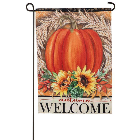 A garden flag that features a large orange pumpkin, framed by a wreath of wheat and sunflowers. Below there is text that reads 'autumn welcome'.