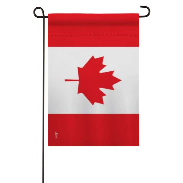 A Canada Garden Flag on a garden flagpole. The flag features 2 red bands on the top and bottom, and a white field in the center. There is a sideways red maple leaf in the center.