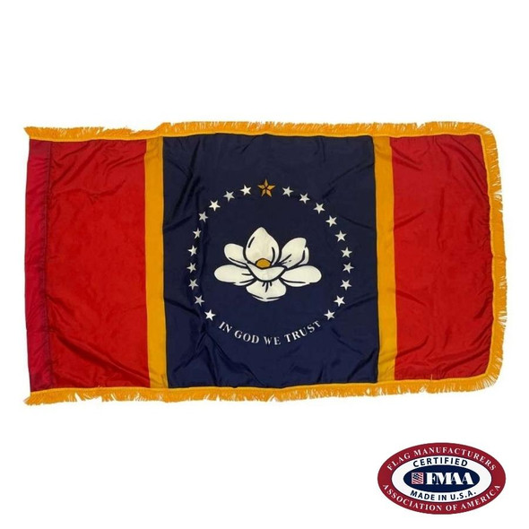 The indoor Mississippi flag has 3 sides of gold fringe around the red & blue tricolor. In the center is a white magnolia circled by stars. FMAA Certified Made in America seal.