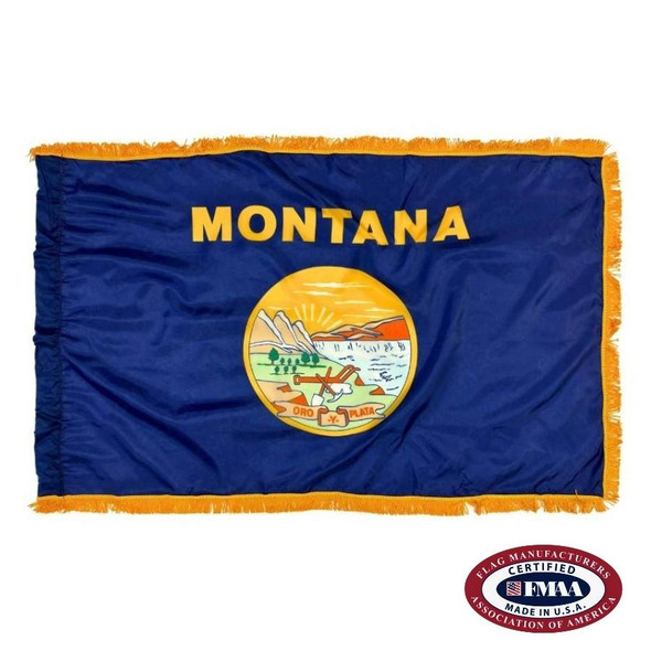 The indoor Montana flag has 3 sides of gold fringe around the dark blue field. In the center is the state name in gold above the state seal. FMAA Certified Made in America seal.
