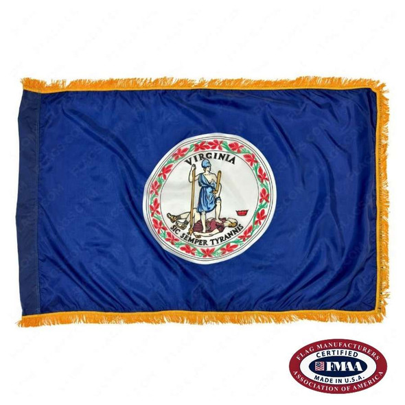 The indoor Virginia flag has 3 sides of gold fringe around the dark blue field. In the center is a seal depicting a woman standing over a king. FMAA Certified Made in America seal.
