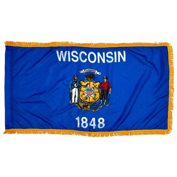 The indoor Wisconsin flag has 3 sides of gold fringe around a blue field. In the center is a coat of arms depicting a sailor and yeoman.