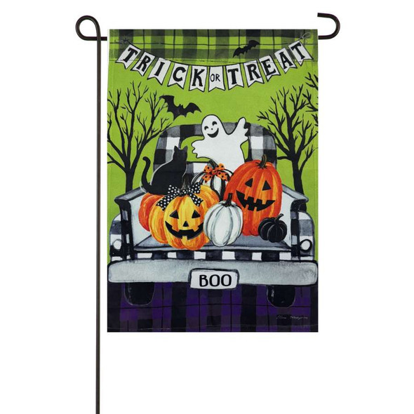 A green Halloween garden flag depicting the back of a truck filled with pumpkins, a cat, and a ghost. A banner at the top reads "Trick or Treat."