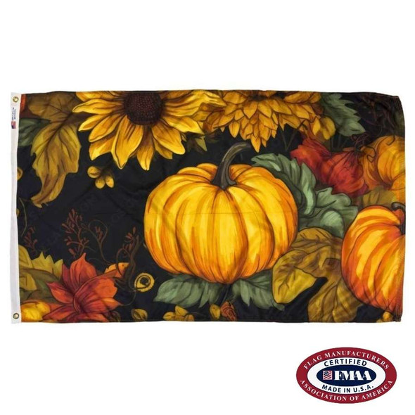 A black flag picturing an orange pumpkin, surrounded by sunflowers, leaves, and other pumpkins. FMAA Made in America seal.