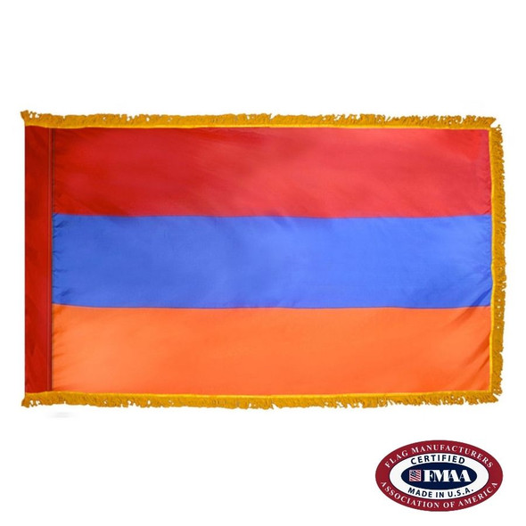 The indoor Armenia flag has 3 sides of gold fringe around a red, blue, and orange tricolor flag. FMAA Certified Made in America seal.
