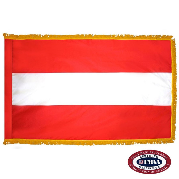 The indoor Austria flag has 3 sides of gold fringe around the 3 red, white, and red horizontal stripes. FMAA Certified Made in America seal.