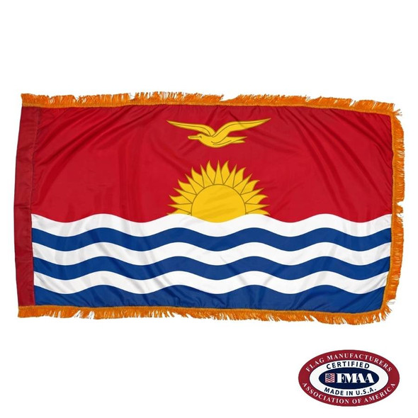 The indoor Kiribati flag has 3 sides of gold fringe around a red field depicting a bird flying over the sun and ocean. FMAA Certified Made in America seal.