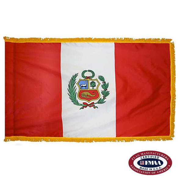 The indoor Peru flag has 3 sides of gold fringe around vertical red and white triband with a coat of arms in the center. FMAA Certified Made in America seal.