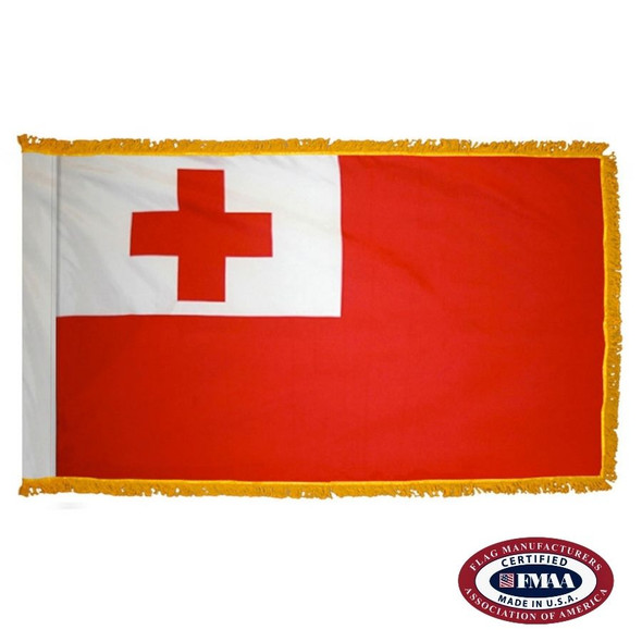 The indoor Tonga flag has 3 sides of gold fringe around a red field with a white canton that contains a red cross. FMAA Certified Made in America seal.