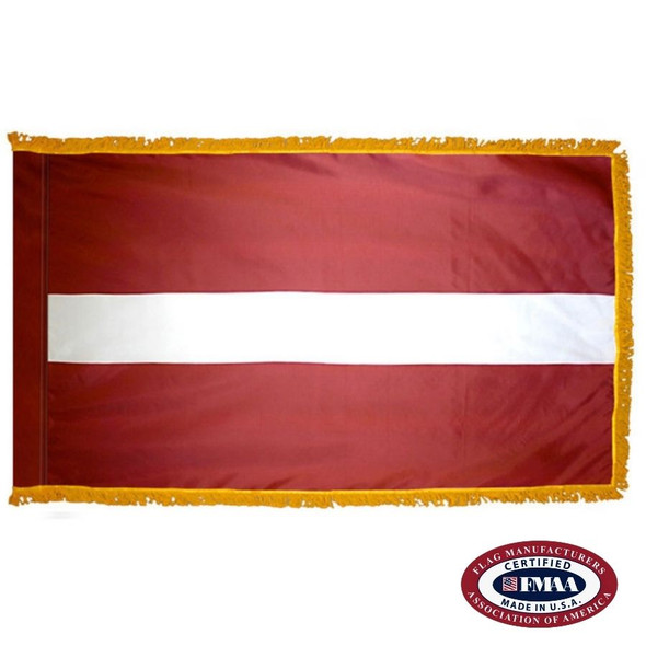The indoor Latvia flag has 3 sides of gold fringe around a dark red field with a horizontal white stripe in the center. FMAA Certified Made in America seal.