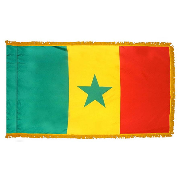 The indoor Senegal flag has 3 sides of gold fringe around a vertical green, yellow, and red tricolor with a green star in the center.