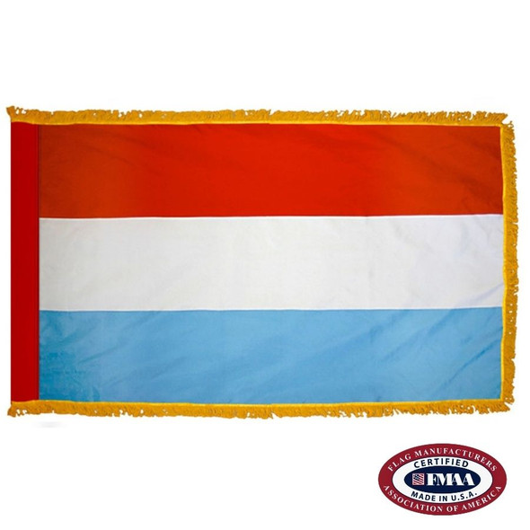The indoor Luxembourg flag has 3 sides of gold fringe around a horizontal red, white, and blue tricolor. FMAA Certified Made in America seal.