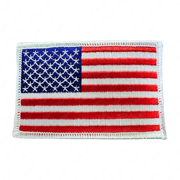 Small red, white, and blue American flag embroidered patch with a white stitching outline.