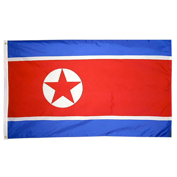 A North Korean flag made of nylon with lock stitching, polyester canvas heading, and brass grommets. Design is a central red panel, bordered above and below with narrow white stripes and broad blue stripes with an emblem of a red star surrounded by a white circle centered slightly left.