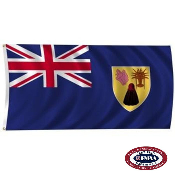 The Turks & Caicos flag is blue with a Union Jack in the canton. On the right is the lesser coat of arms with a shell, lobster & cactus. FMAA Certified Made in America seal.