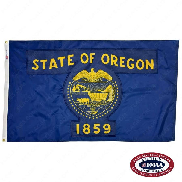 The blue Oregon flag has the text “State of Oregon / 1859” surrounding an eagle, ships, and a wagon. FMAA Certified Made in America seal.