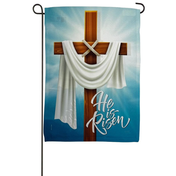 The garden flag depicts a wood cross draped with white cloth. The background is blue with a white light. The right side has blue text that reads "He Is Risen"