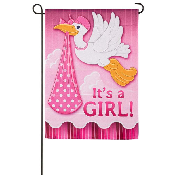 A pink garden flag depicting a white stork carrying a pink bundle above the text "It's a Girl!".