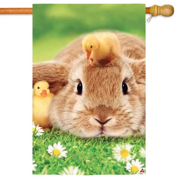 The Bunny & Ducklings House Flag depicts a brown bunny lying on a field of daisies with ducklings next to it and on its head.