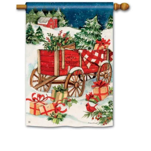 This house flag features a wagon in snow carrying Christmas trees and giftboxes.