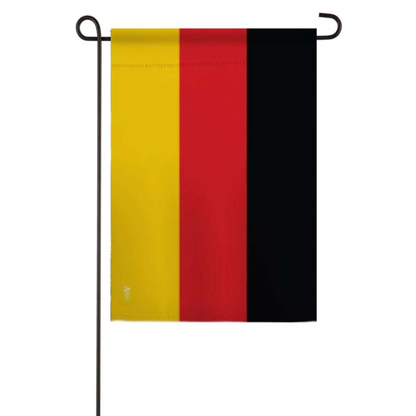 A Germany garden flag is attached to a flagpole. The flag has 3 vertical stripes of yellow, red, and black.